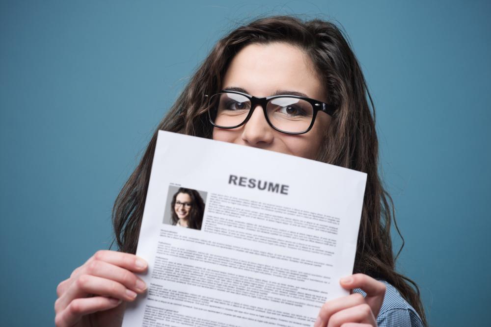 teenage girl holding her resume