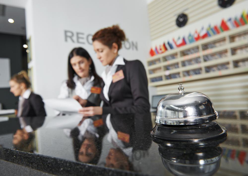 closeup of hotel reception desk service bell