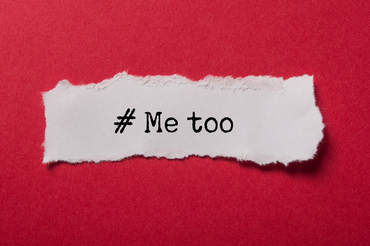 scrap paper reading "#metoo" on red background