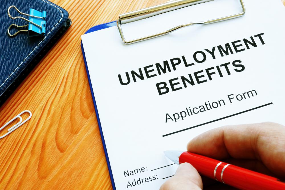Man fills in Unemployment benefits application form