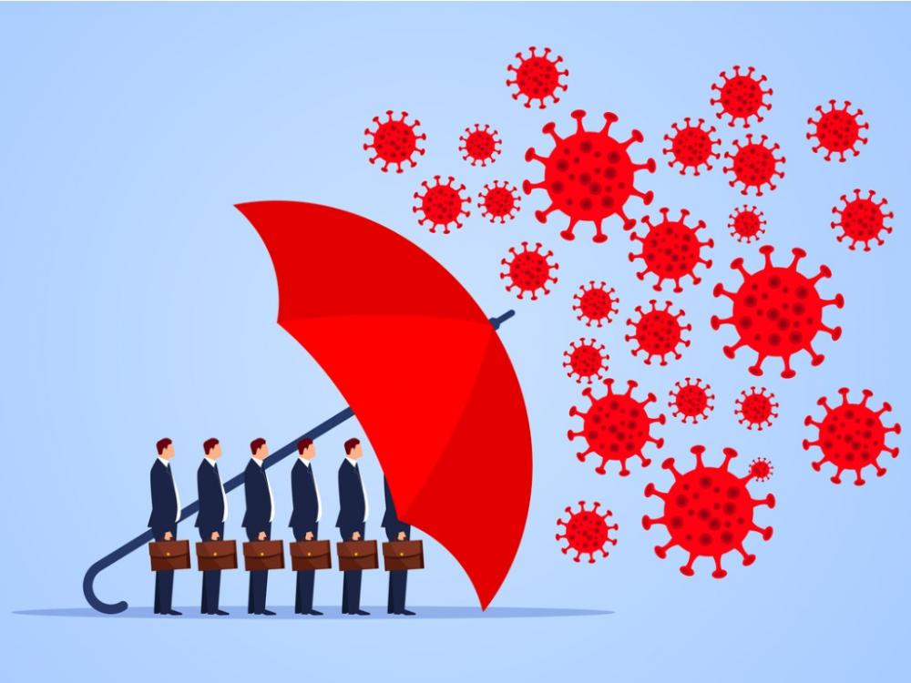 group of businessmen protected from bacteria by large red umbrella