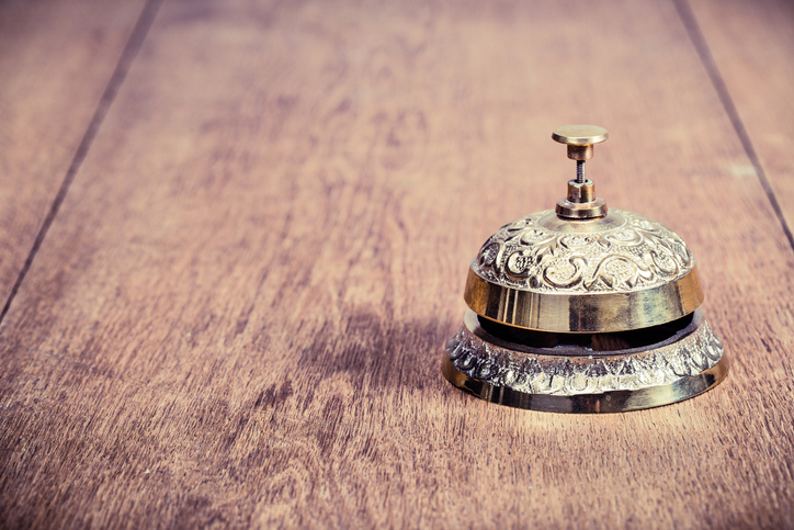 service bell on wooden background