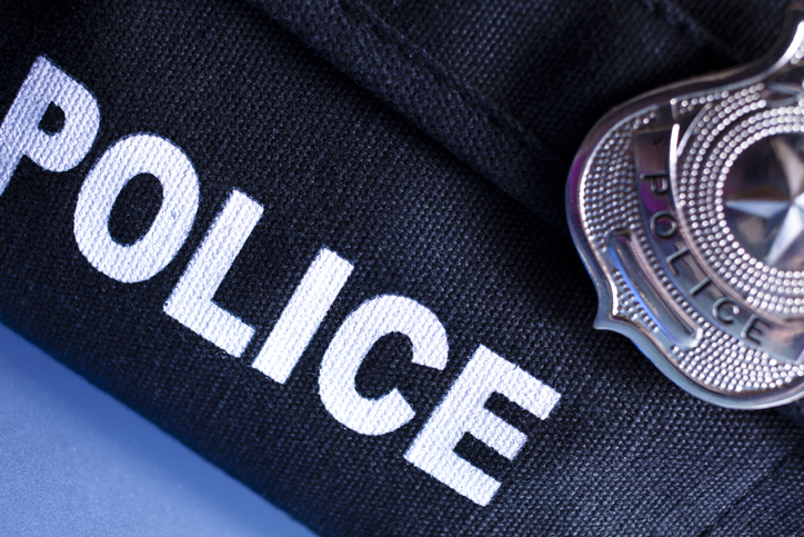 close up of police bulletproof vest and badge