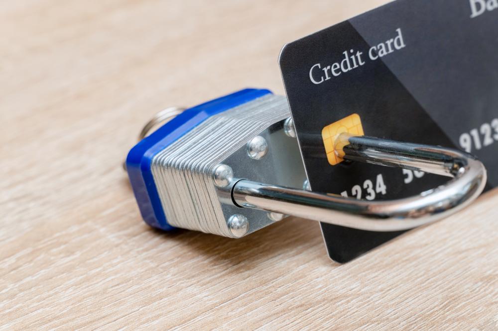 credit card chip locked with metal padlock