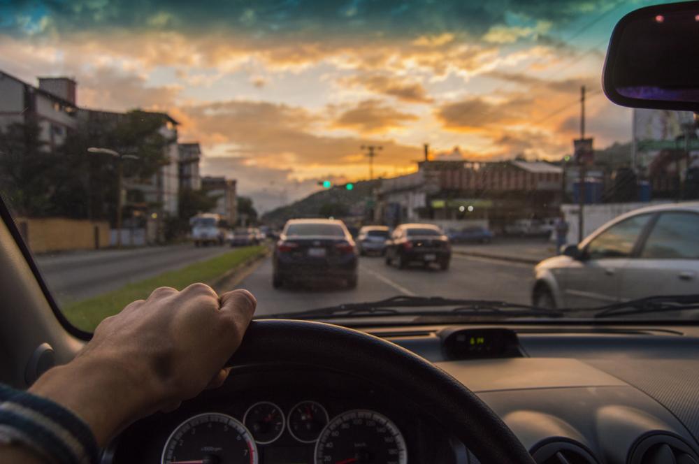driving at sunset from driver's point of view