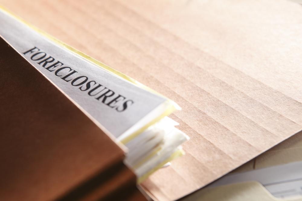 foreclosure documents in a brown file folder