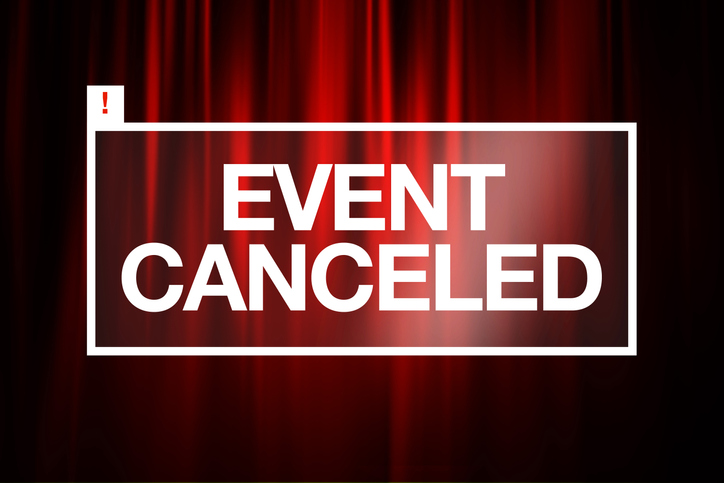 Event Cancelled notication in front of red curtains