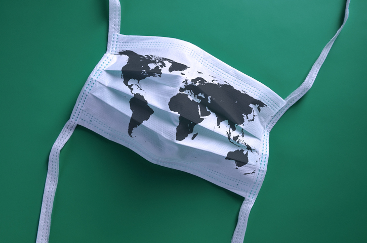 Face mask with worldmap imprint on green background