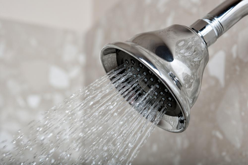 A close-up image of running water from a shower head.